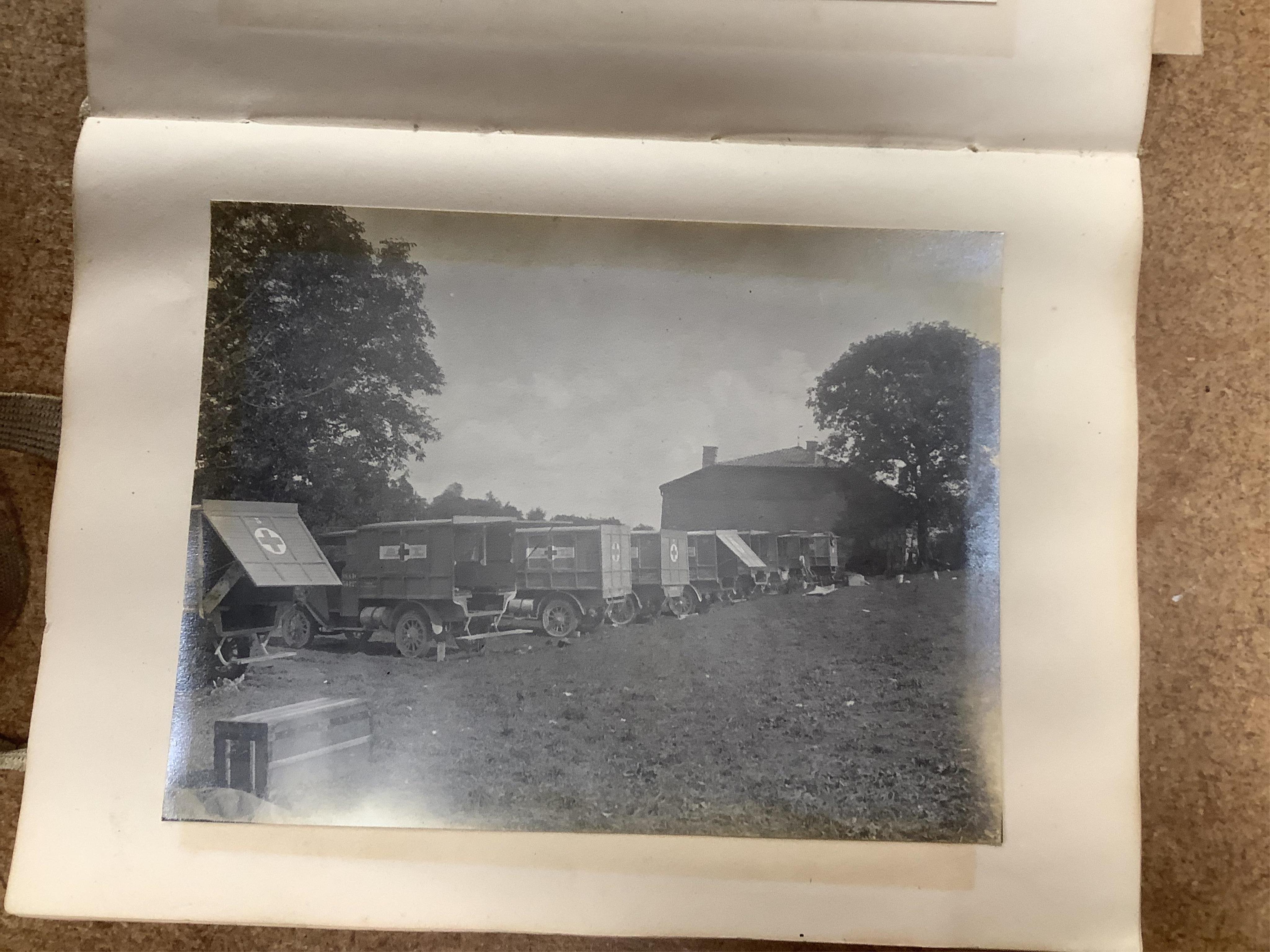 A WWI Ambulance and Balloon Brigade photograph album, pocket watch, coin, etc. Condition - fair, pocket watch ticks when wound